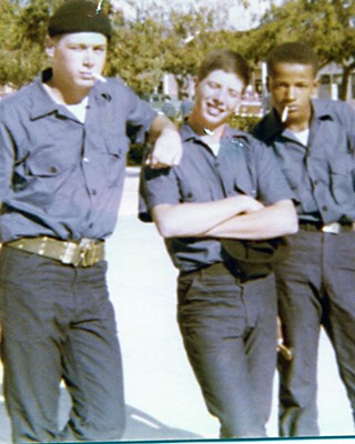 Poulter (center) with friends in the Navy