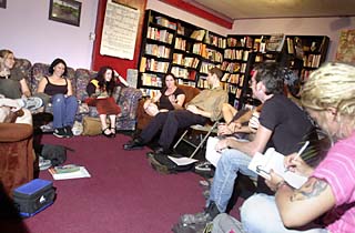 A July 30 collective meeting at MonkeyWrench Books, including a pre-mohawk  Connor Hopkins (second from right) and Sarah Lange (second from left)