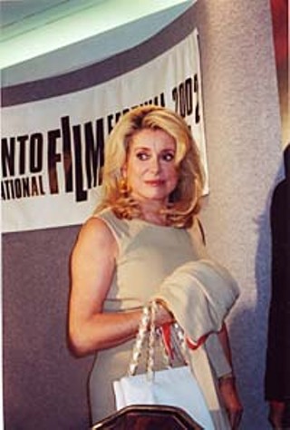Equally important as seeing the movies is seeing the stars and discovering, for example, that Catherine Deneuve (promoting her new film, <i>8 Women</i>) looks even better in person than she does in the movies.