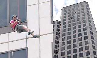 Josh Martinez rappels the 32 stories of One American Center, raising money for the Make-a-Wish Foundation.