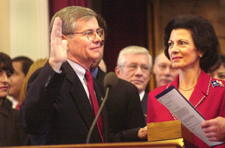 Tom Craddick of Midland, accompanied by his wife Nadine, was sworn in Tuesday as the new Speaker of the Texas House of Representatives. Craddick won the speakership by a vote of 149-1, with only Lon Burnam of Fort Worth voting against him. He becomes the first Republican speaker since Reconstruction, replacing Democrat Pete Laney of Hale Center. For more on both Craddick and Burnam, see Capitol Chronicle and Naked City.