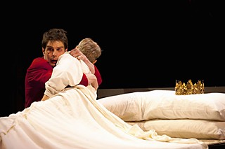 Prince Hal (John Tufts) embraces his father (Richard Howard), whom he believes to be dead in the Oregon Shakespeare Festival production of <i>Henry IV, Part 2</i>.