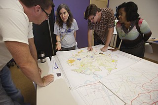 The first public appearance of the city’s new comprehensive plan, replete with growth concept maps and priority goals, made its public debut Oct. 1 at an Imagine Austin release party at the Carver Museum & Cultural Center. The event drew about 600 people, including (l-r) Jason Grice, Latinka Sampson, Stephen Bell, and Toya Haley.