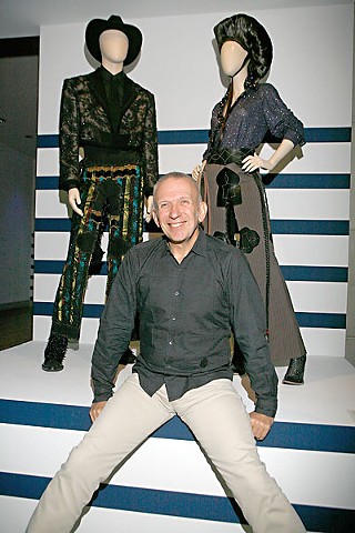 Jean Paul Gaultier stood at the entrance of his retrospective at the opening night, greeting guests and signing copies of the catalog.
