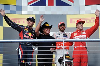 Left: (l-r) Sebastian Vettel (Germany, second), racing legend Mario Andretti, Lewis Hamilton (United Kingdom, first), and Fernando Alonso (Spain, third).
