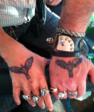 Hands down: Depp (l) and Carter share three tattoos. These were inked last year during the Toronto Film Festival, which screened the West Memphis 3 documentary executive produced by Depp.