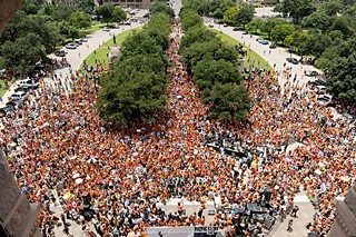 An estimated 5,000 people, most of them wearing orange, crowded the Capitol grounds Monday, the first day of the Lege's second special session, 
to rally against proposed abortion legislation that state Republicans have vowed to push through this time around.