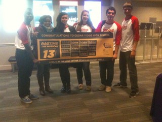 Cedar Ridge students show off the banner recognizing the 13 nominations for the school's production of 'Ragtime'