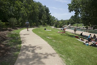 Improvements to Barton Springs Pool's south side, including this paved walkway to the pool, made their official debut Wednesday 
in a public celebration. For more images see <b><a href=http://austinchronicle.com/photos>austinchronicle.com/photos</a></b>.