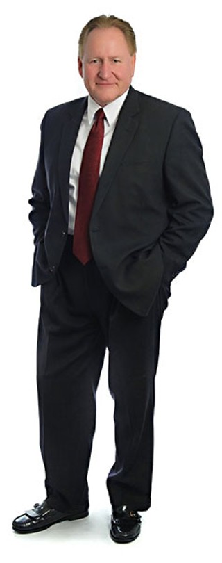 Mark Keough, academic expert, pastor,  and former car salesman