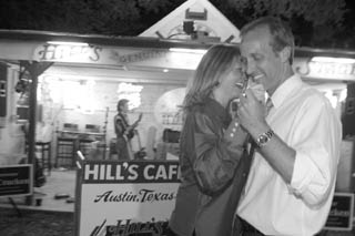 Brewster McCracken dances with his wife Mindy at Hill's Cafe, celebrating his election victory on Saturday.