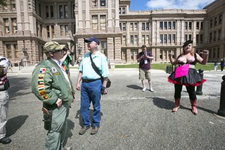 Open Carry Texas founder C.J. Grisham clashes with a counter protester