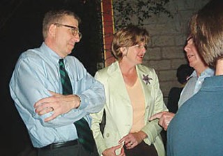 Hospital district steering committee Chair Clarke Heidrick and wife Catherine celebrate the district's election victory with supporter Lowell Leberman (partially obscured) on election night.