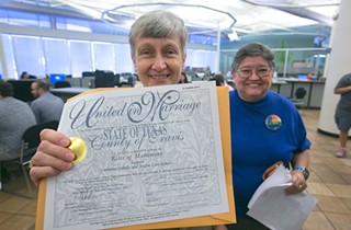 A Travis County couple picks up their marriage license on July 4, 2015 following the legalization of same-sex marriage by the U.S. Supreme Court.