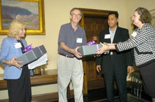 The Austin History Center Association presented these ceremonial empty boxes to be filled with the papers of outgoing Council Members Daryl Slusher and Jackie Goodman.