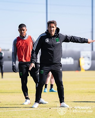 Jhojan Valencia (left) takes instructions from Austin FC coach Josh Wolff in a training session