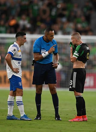 Austin resident Ismail Elfath (center) referees the inaugural MLS match at Q2 Stadium between Austin FC and the San Jose Earthquakes on June 19, 2021