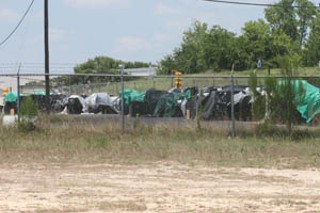 Nearly 1,000 eight-liner gaming machines have been sitting for more than a month, exposed to the elements, on the edge of the Austin Police Department academy driving course. The machines, allegedly used for illegal gambling, were seized by police during a citywide raid in June.