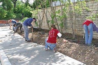 Friends of Deep Eddy landscaping volunteers at work outside the entryway to the restored bathhouse, May 2007