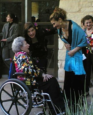 Lady Bird Johnson, with daughter Luci (center), greets Austin artist Ana Fuentes at the Lady Bird Johnson Wild Flower Center Gala in May.