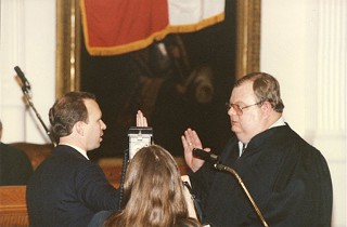 Baird taking his oath of office in 1990