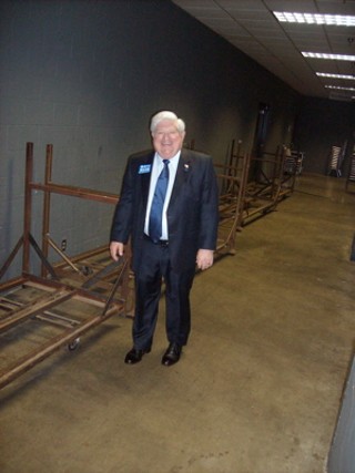 TDP Chair Boyd Richie heads to the media room backstage at the Convention Center.