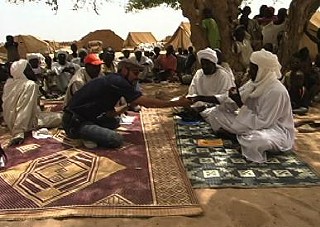 Tenango speaking with a sheik who had just arrived at a refugee camp in Eastern Chad. 6 May 2008