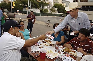 Democrat Larry Joe Doherty (in cowboy hat) pitches his candidacy to union members at this year's AFL-CIO Labor Day Fish Fry in Austin.