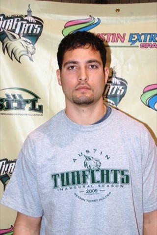 Robert Quiroga after signing with the Turfcats