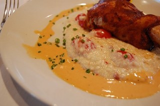 Chef Blank's Sausage-Stuffed Quail on Cheese Grits with Grape Tomatoes