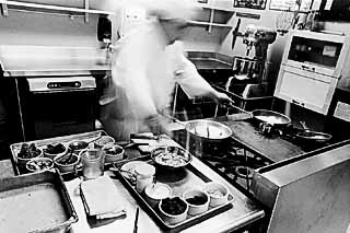 A student at Austin Community College's Culinary Arts Program works the hot line.