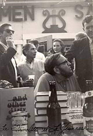 Holding a booksigning at Scholz Garten (in this case, for Larry L. King's  <i>… and other dirty stories</i> in 1968) is the epitome of Mad Dog style:  a little beer with your books. The man smoking behind King (seated)  is artist Fletcher Boone, and behind him, Bill Brammer.
<p>(Larry L. King Archives, Southwestern Writers Collection, Southwest Texas State University)