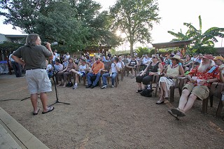 Curtis Clarke, owner of Evangeline Cafe, addresses a crowd of people who showed up at Threadgill's last week to air their grievances over programming changes and cutbacks at KUT radio.