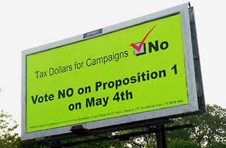 Bright yellow billboards against Prop. 1 popped up all over Austin last week.