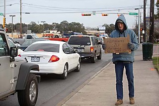 A homeless man at Congress and Oltorf weathers the deep chill that struck Austin last week, sending thousands of homeless men and women to shelters around town and forcing the city to turn recreational centers into temporary shelters. See <a href=http://www.austinchronicle.com/gyrobase/Issue/story?oid=oid%3A938348><b>Frozen Assets: AWU and the Busted Pipes</b></a> for more cold weather news.