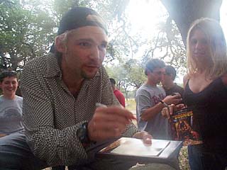Touched by a Goonie: Corey Feldman signs autographs at last weekend's Ultimate <i>Goonies</i> Experience.