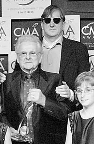 T-Bone Burnett (in sunglasses) and his friend of constant sorrow, Ralph Stanley, at the 2001 CMA awards