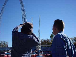 Filmmaker Robert Rodriguez and Reel FX founder Dale Carmen discuss a shot on  location at Six Flags in Arlington.