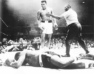Photo of Mahamed Ali standing over knocked-out opponent
